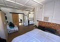 Casa de campo de 3 dormitorios con un apartamento anexo de 2 dormitorios más un estudio de 1 dormitorio en Sax. in Spanish Fincas