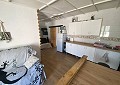 Casa de campo de 3 dormitorios con un apartamento anexo de 2 dormitorios más un estudio de 1 dormitorio en Sax. in Spanish Fincas
