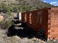Gran parcela con construcción incompleta in Spanish Fincas