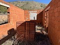 Gran parcela con construcción incompleta in Spanish Fincas