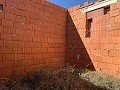 Gran parcela con construcción incompleta in Spanish Fincas