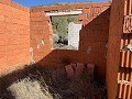 Gran parcela con construcción incompleta in Spanish Fincas